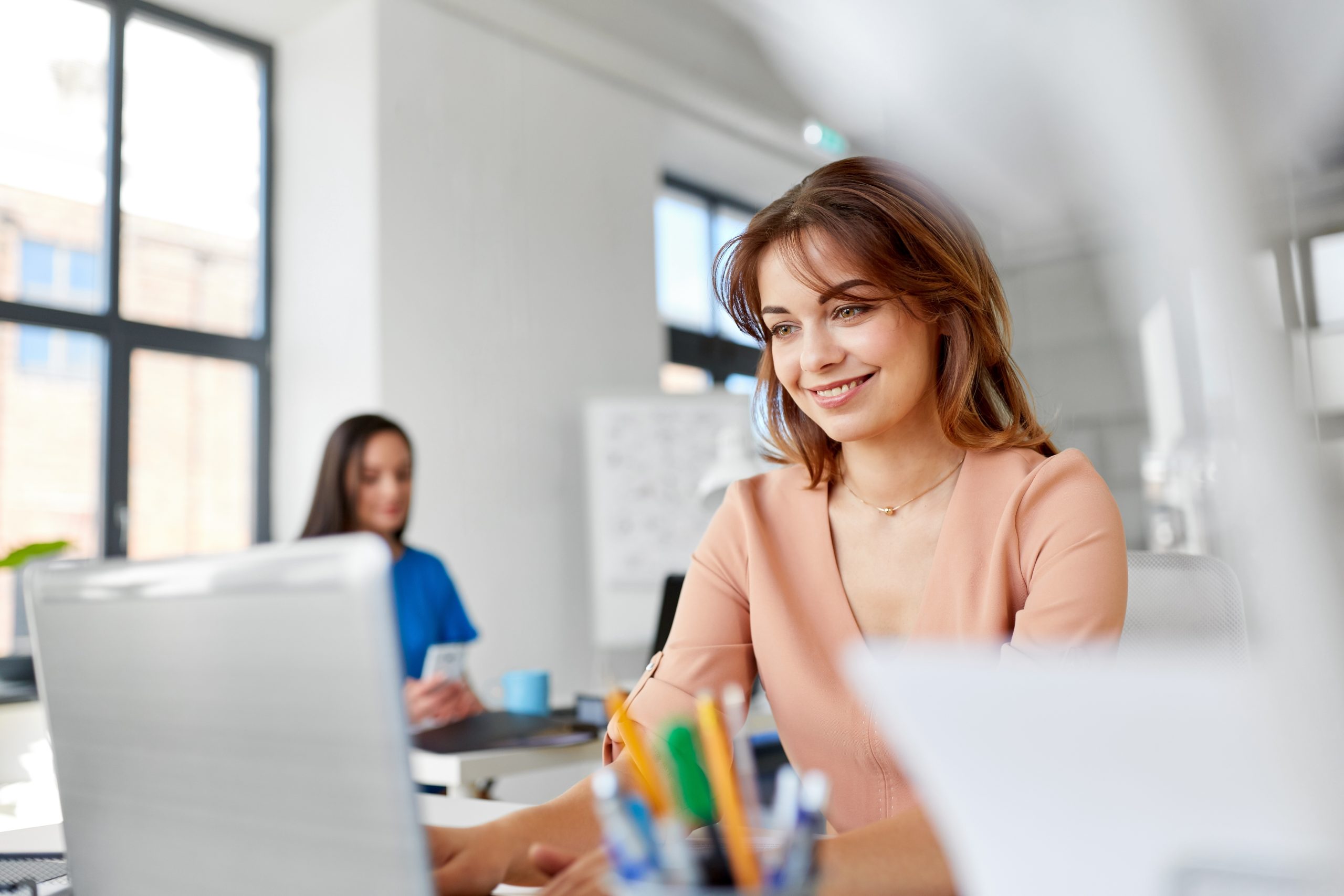 Home 28 happy businesswoman with laptop working office scaled Home Proficiency English